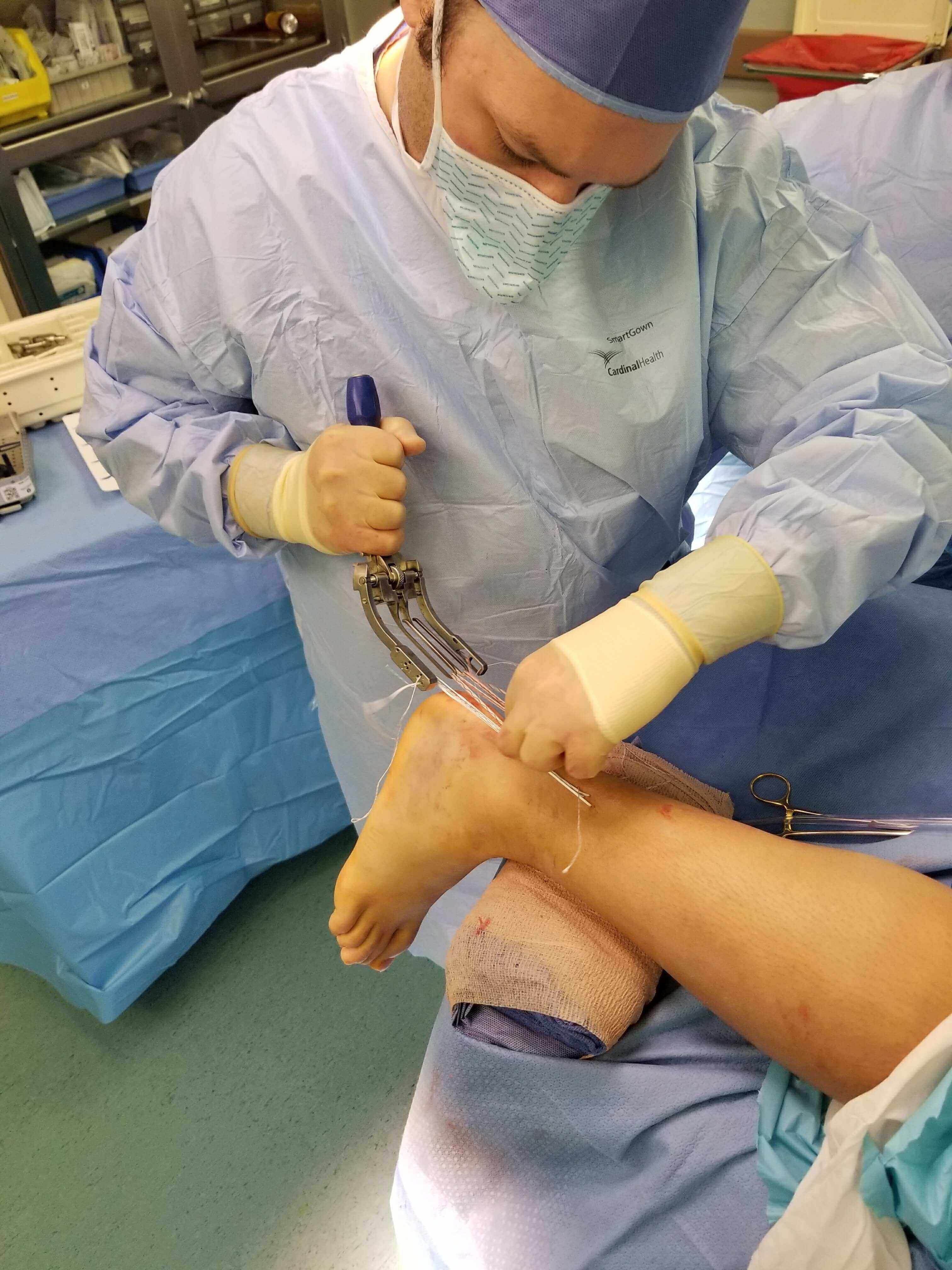Surgeon performing ankle surgery.