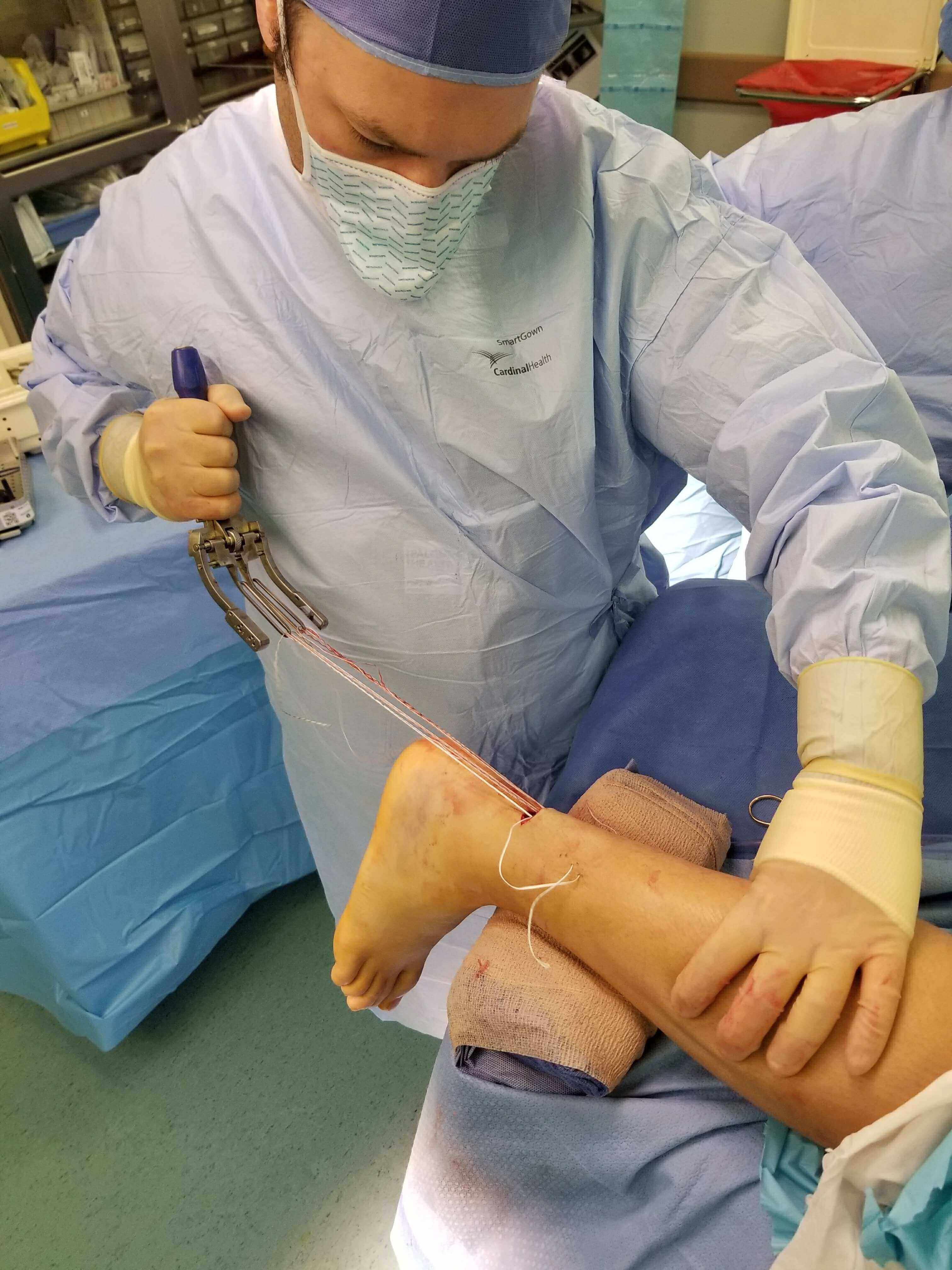 Surgeon performing ankle surgery.
